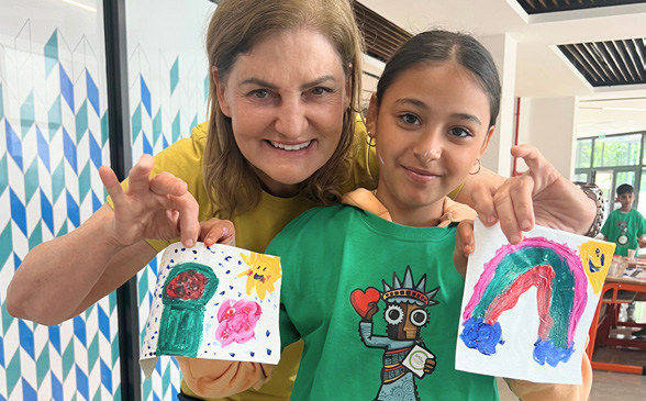 Teacher and student with artwork
